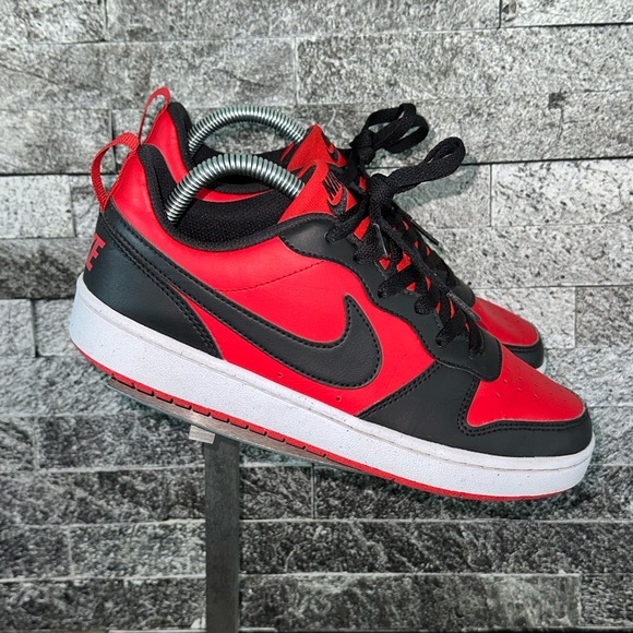 red and black nike court borough